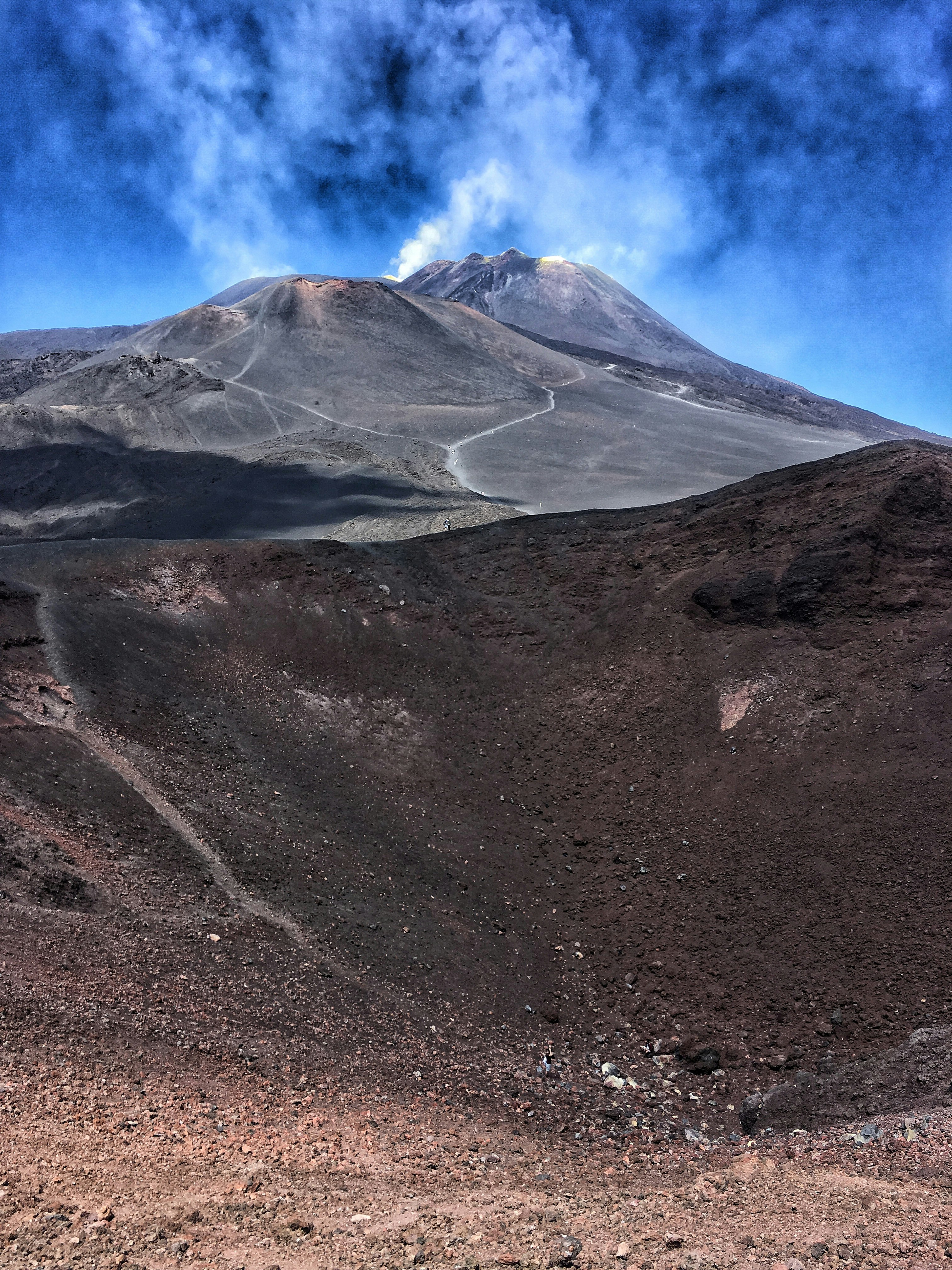 gray and white mountain under white clouds during daytime